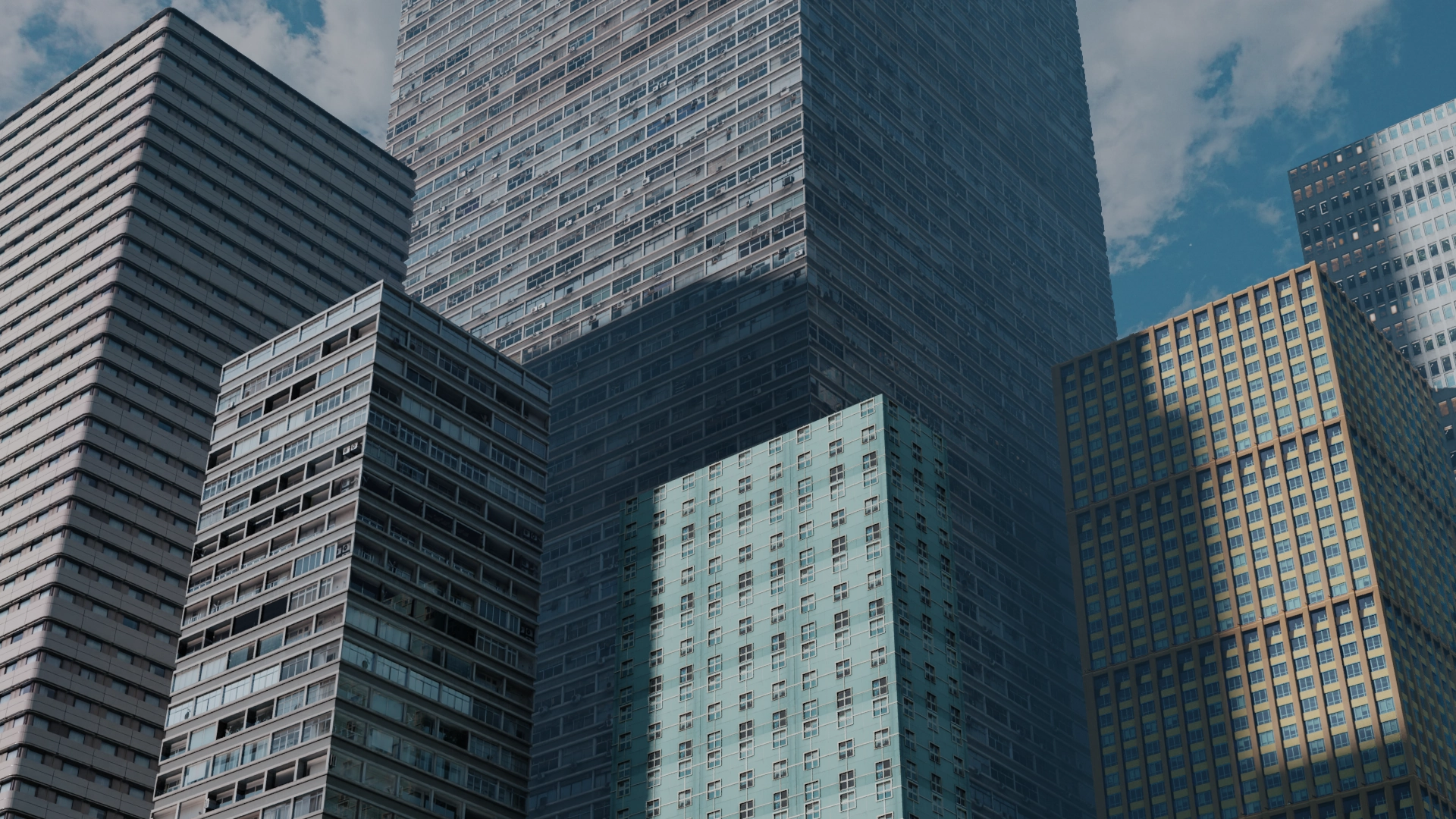 A 3D view of six different realistic-looking buildings.